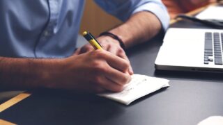 man write plan desk notes pen 593333